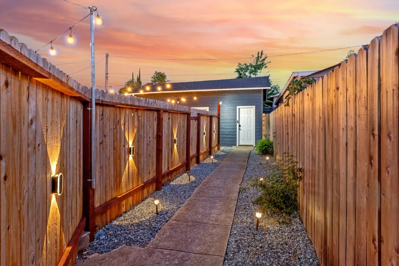 Lit side walkway to the studio